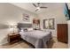 Bedroom with queen bed and ceiling fan at 14000 N 94Th St # 1134, Scottsdale, AZ 85260