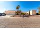 Single-story home with a three-car garage and desert landscaping at 14778 S Oakmont Dr, Arizona City, AZ 85123