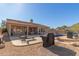 Inviting backyard oasis with a sparkling pool, patio furniture, and a built-in grill at 14806 E Crested Crown --, Fountain Hills, AZ 85268