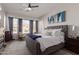 Main bedroom with large windows, plush bedding, and access to patio at 14806 E Crested Crown --, Fountain Hills, AZ 85268