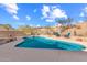 Inviting kidney-shaped pool with patio seating and mountain views at 14806 E Crested Crown --, Fountain Hills, AZ 85268