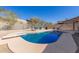 Relaxing kidney-shaped pool with a diving board and patio seating at 14806 E Crested Crown --, Fountain Hills, AZ 85268