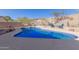 Inviting kidney-shaped pool with diving board and mountain views at 14806 E Crested Crown --, Fountain Hills, AZ 85268