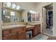 Elegant bathroom with dual vanities and walk-in closet access at 14849 E Valley Vista Dr, Fountain Hills, AZ 85268