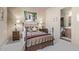 Guest bedroom with a metal bed frame and ensuite bathroom at 14849 E Valley Vista Dr, Fountain Hills, AZ 85268