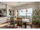 Bright dining room features rustic table, chairs, and scenic views at 14849 E Valley Vista Dr, Fountain Hills, AZ 85268
