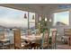 Rustic dining area with large windows, offering scenic views and ample natural light at 14849 E Valley Vista Dr, Fountain Hills, AZ 85268