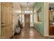 Light and spacious entryway with tile floors, wooden door, and decorative accents at 14849 E Valley Vista Dr, Fountain Hills, AZ 85268