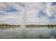 Tall fountain in a lake with a bird swimming by at 14849 E Valley Vista Dr, Fountain Hills, AZ 85268