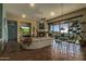 Spacious living area with a fireplace, large sectional sofa, and scenic views at 14849 E Valley Vista Dr, Fountain Hills, AZ 85268