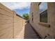 Side yard with a concrete pathway at 15677 W Almeria Rd, Goodyear, AZ 85395