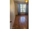 Bedroom with wood-look flooring and window coverings at 15835 S 30Th Pl, Phoenix, AZ 85048