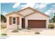 One-story home with brown garage door and light-colored siding at 17662 W Bajada Rd, Surprise, AZ 85387