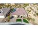 Single story house with tile roof and a two-car garage at 21122 W Edgemont Ave, Buckeye, AZ 85396
