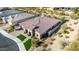 Single-story house with tile roof and solar panels, viewed from above at 21122 W Edgemont Ave, Buckeye, AZ 85396