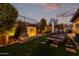 Landscaped backyard with water feature, providing a tranquil outdoor space at 21122 W Edgemont Ave, Buckeye, AZ 85396
