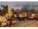 Evening view of a relaxing backyard patio with comfortable seating at 21122 W Edgemont Ave, Buckeye, AZ 85396