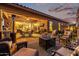 Relaxing backyard patio with seating area, fire pit, and outdoor kitchen at 21122 W Edgemont Ave, Buckeye, AZ 85396