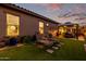 Landscaped backyard with lounge chairs and gazebo at 21122 W Edgemont Ave, Buckeye, AZ 85396