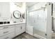 Bathroom features a walk-in shower, double vanity, and white cabinets at 21122 W Edgemont Ave, Buckeye, AZ 85396