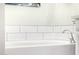 White bathtub with modern fixtures at 21122 W Edgemont Ave, Buckeye, AZ 85396