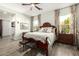 Main bedroom with wood bed frame and plenty of light at 21122 W Edgemont Ave, Buckeye, AZ 85396