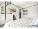 Bedroom with canopy bed, built-in shelving and access to hallway at 21122 W Edgemont Ave, Buckeye, AZ 85396