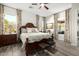 Spacious bedroom with large windows and wood floors at 21122 W Edgemont Ave, Buckeye, AZ 85396