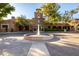 Elegant clubhouse entrance with a central fountain at 21122 W Edgemont Ave, Buckeye, AZ 85396