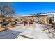 Community area with grills, tables, and a pergola at 21122 W Edgemont Ave, Buckeye, AZ 85396