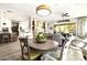 Kitchen dining area with table and chairs, offering views into the living room at 21122 W Edgemont Ave, Buckeye, AZ 85396