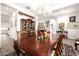 Bright dining room features a large table and kitchen views at 21122 W Edgemont Ave, Buckeye, AZ 85396