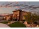 Beautiful desert home with landscaped yard, large driveway and three-car garage at 21122 W Edgemont Ave, Buckeye, AZ 85396