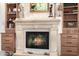 Elegant fireplace with built-in shelving at 21122 W Edgemont Ave, Buckeye, AZ 85396