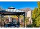 Covered patio gazebo with seating area and mountain views at 21122 W Edgemont Ave, Buckeye, AZ 85396