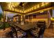 Evening view of a covered patio with dining table at 21122 W Edgemont Ave, Buckeye, AZ 85396