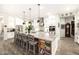 Gourmet kitchen boasts expansive island, stainless steel appliances, and ample cabinetry at 21122 W Edgemont Ave, Buckeye, AZ 85396