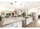 Modern kitchen with large island, stainless steel appliances, and granite countertops at 21122 W Edgemont Ave, Buckeye, AZ 85396