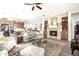 Open living room showcasing a fireplace and access to kitchen at 21122 W Edgemont Ave, Buckeye, AZ 85396