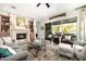 Spacious living area featuring a fireplace and lots of natural light at 21122 W Edgemont Ave, Buckeye, AZ 85396