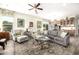 Bright living room with fireplace and comfortable seating at 21122 W Edgemont Ave, Buckeye, AZ 85396