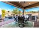 Covered patio with outdoor kitchen, seating, and heating at 21122 W Edgemont Ave, Buckeye, AZ 85396