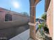 Side yard view with walkway, desert plants and a home in background at 21209 N 40Th Ave, Glendale, AZ 85308
