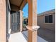 Backyard access with a metal security door and desert plants at 21209 N 40Th Ave, Glendale, AZ 85308