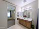 Bathroom features a double vanity and view of bedroom at 21209 N 40Th Ave, Glendale, AZ 85308