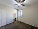 Bedroom with closet and ceiling fan at 21209 N 40Th Ave, Glendale, AZ 85308