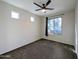 Bright bedroom with ceiling fan and carpet flooring at 21209 N 40Th Ave, Glendale, AZ 85308