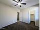 Spacious bedroom with two closets and ceiling fan at 21209 N 40Th Ave, Glendale, AZ 85308