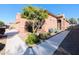 Tan house with a two-car garage and desert landscaping at 21209 N 40Th Ave, Glendale, AZ 85308