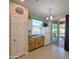 Kitchen features wood cabinets, granite countertops, and access to patio at 21209 N 40Th Ave, Glendale, AZ 85308